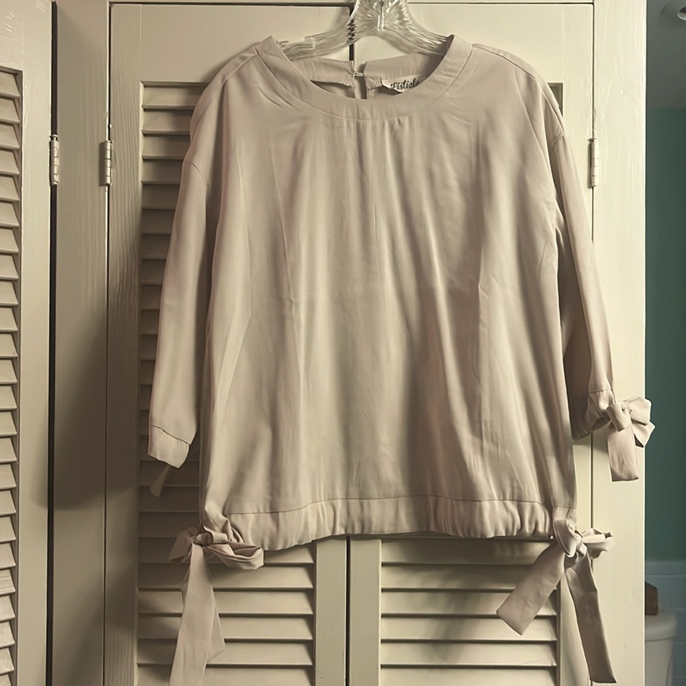 Cream colored blouse with ties